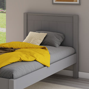 close-up-single-bed-grey-panelled-headboard