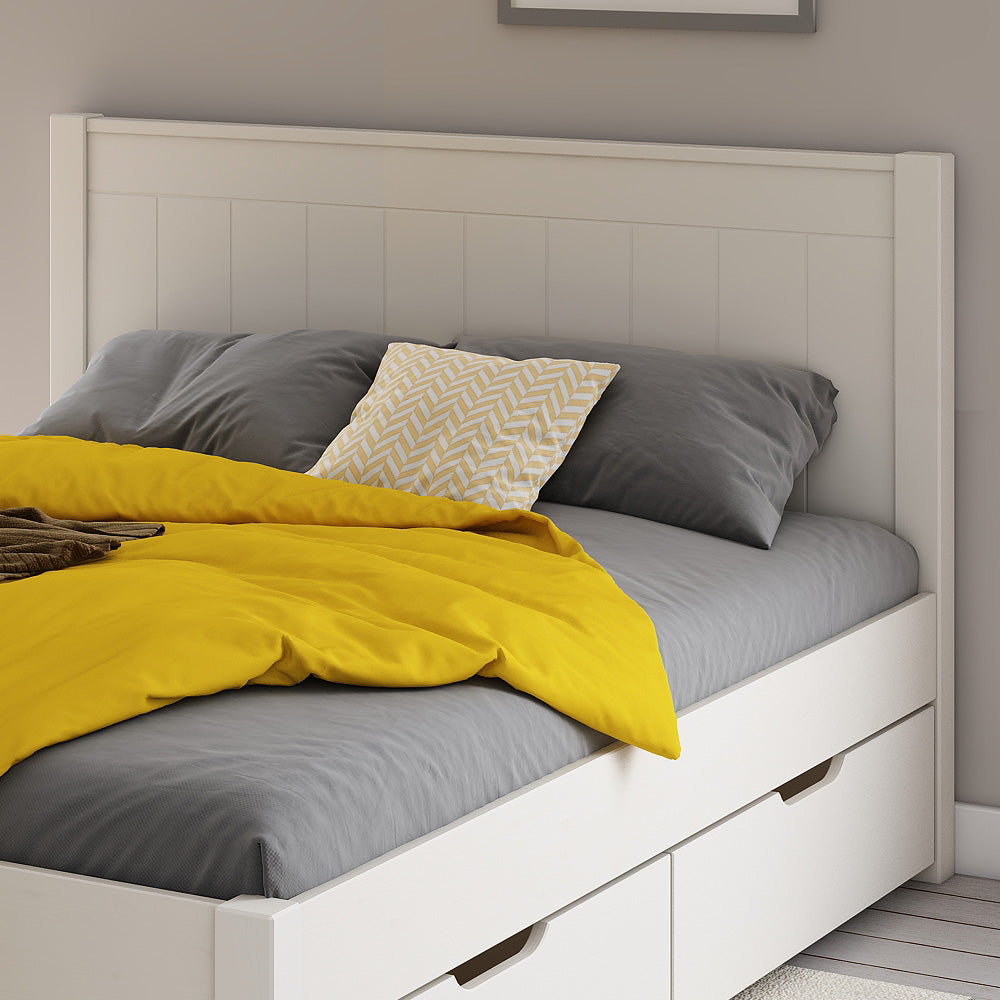 close-up-white-wooden-panelled-headboard-and-two-drawers