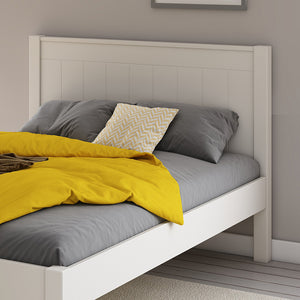 close-up-white-small-double-bed-panelled-headboard