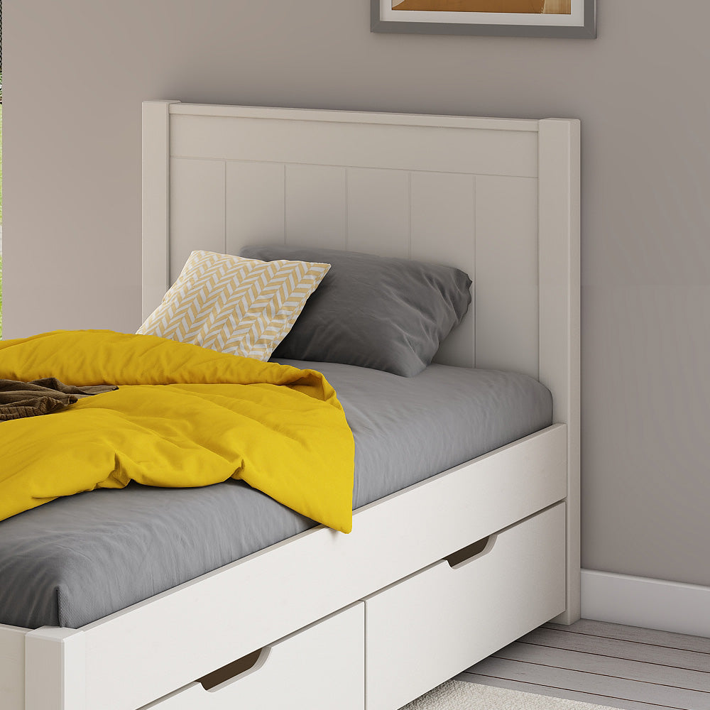 close-up-white-low-end-single-bed-two-drawers-panelled-headboard