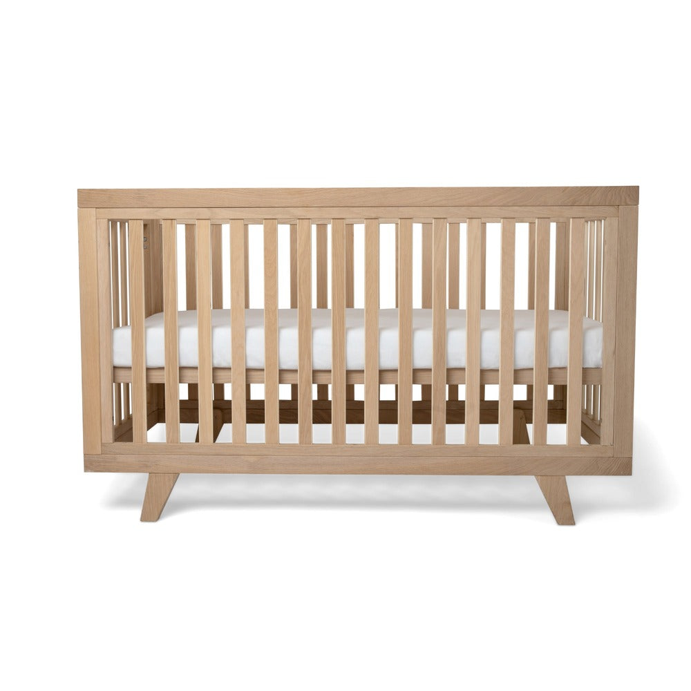 Side view of Clair de Lune Oak Cot Bed